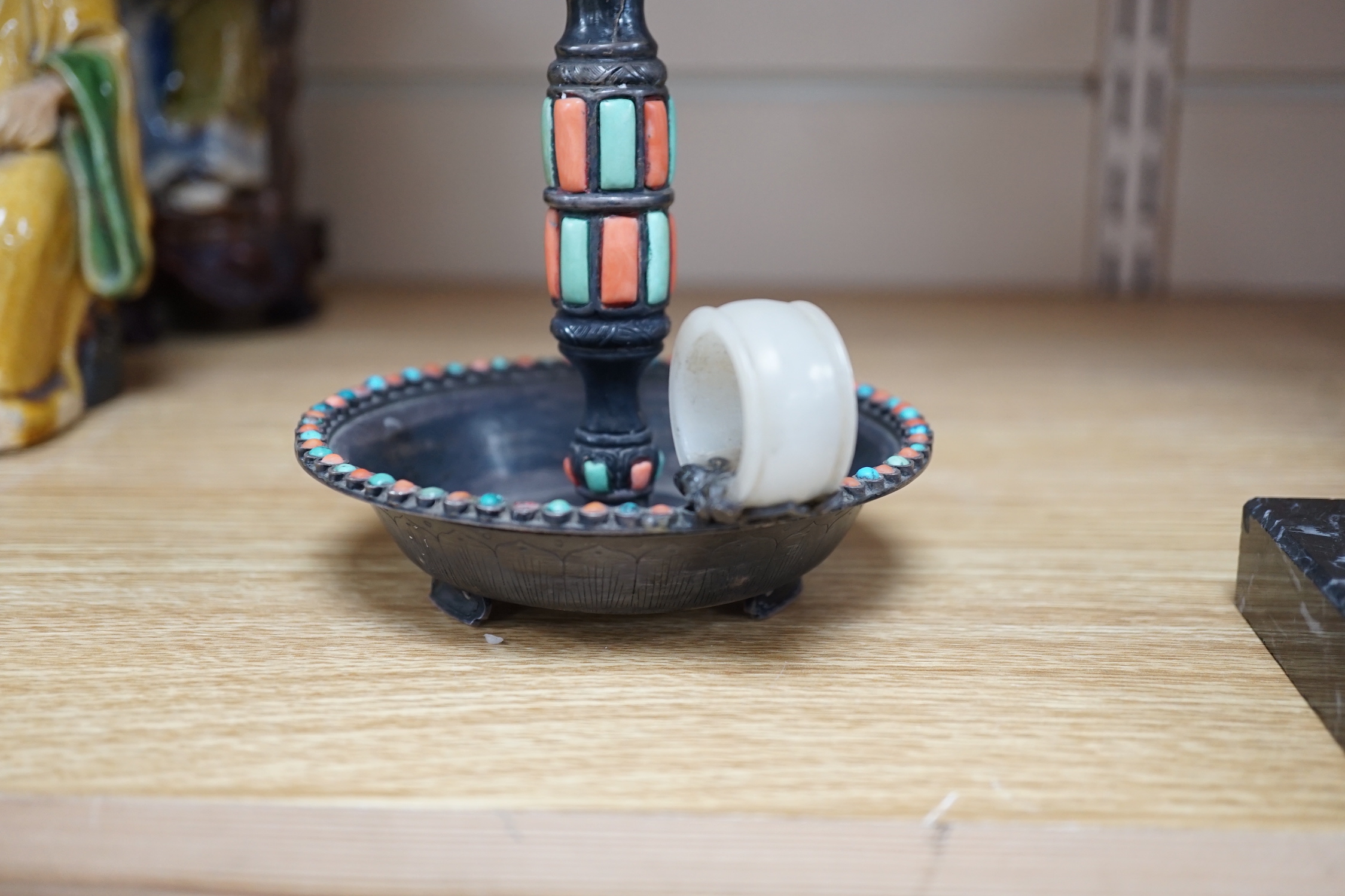 A Chinese white metal jade, coral and turquoise mounted chamberstick, late 19th century, the jade possibly earlier 15cm